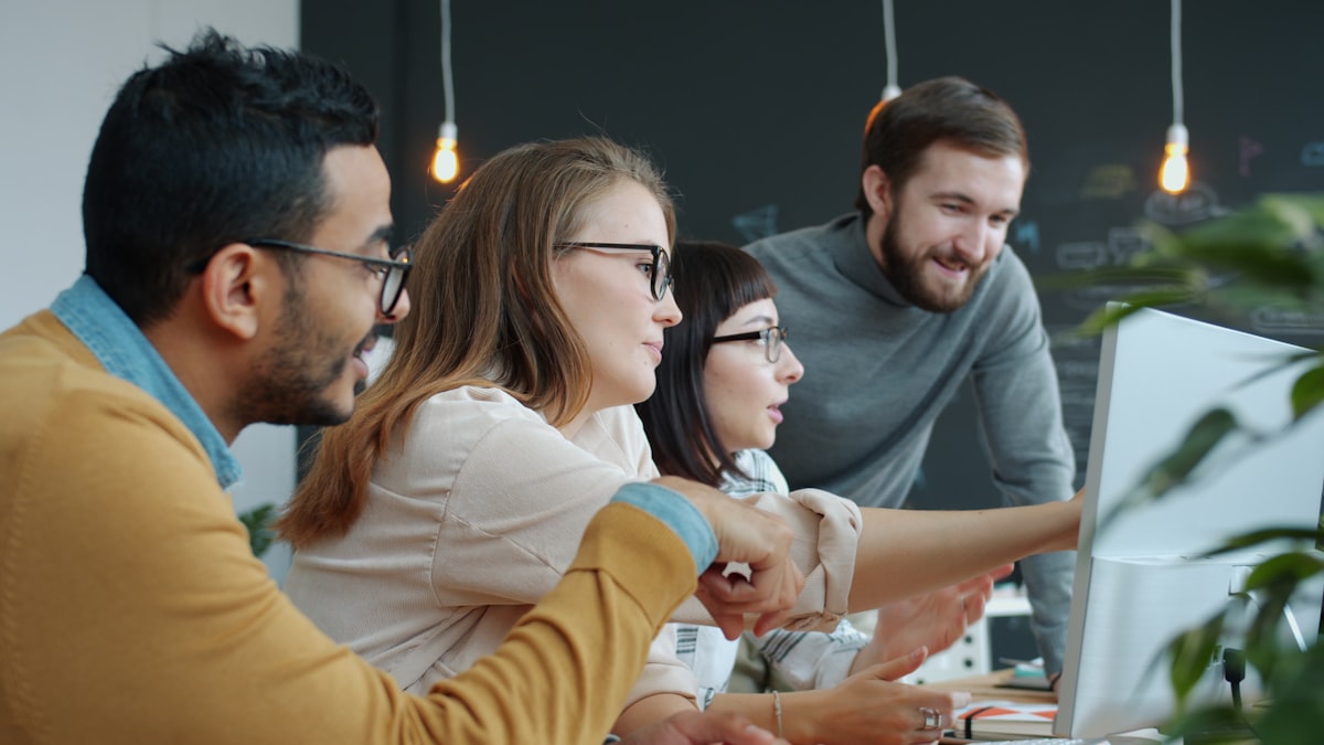 IT support team reviewing a screen together